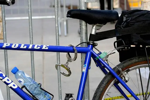 A police bike locked up with handcuffs